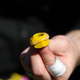 Glue on a lug nut, which a tire changer would then attach to a wheel.